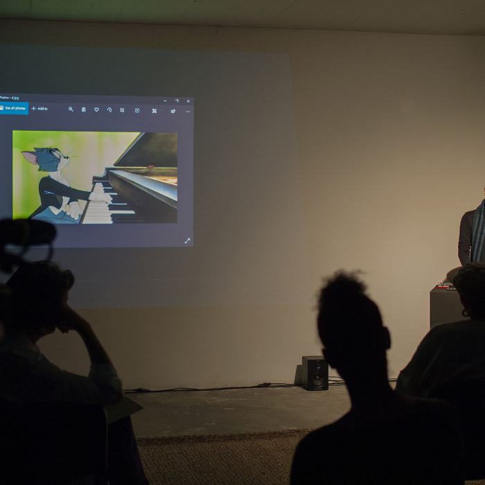 Omar Adel (Master)
The Cat Concerto and The Hegemonic Struggle, lecture-performance, 20', 2020
Omar Adel est actuellement basé entre le Caire (Egypte) et Berne. Il travaille sur la vidéo, le son, la photographie, le design, le codage et les instances performatives.